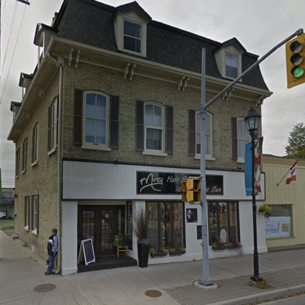 Before photo of building exterior of hair salon located in Cobourg, Ontario