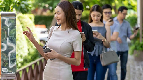 customers-using-their-phones-while-waiting-in-line-1-1296x729.jpg