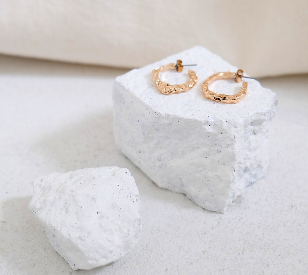 Gold Earrings on Rocks_edited_edited.jpg