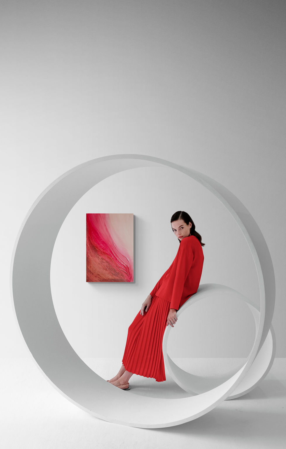 young-woman-posing-with-sculptures