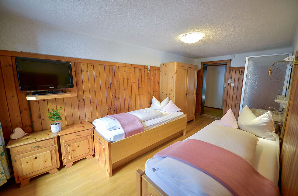 Comfortable interior of rooms 101 and 102 in Chalet Sonne, ideal for families.
