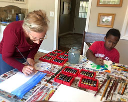 Tara and Kei Gentile, the neurodivergent mom and son creators of ND Life Collection, painting together