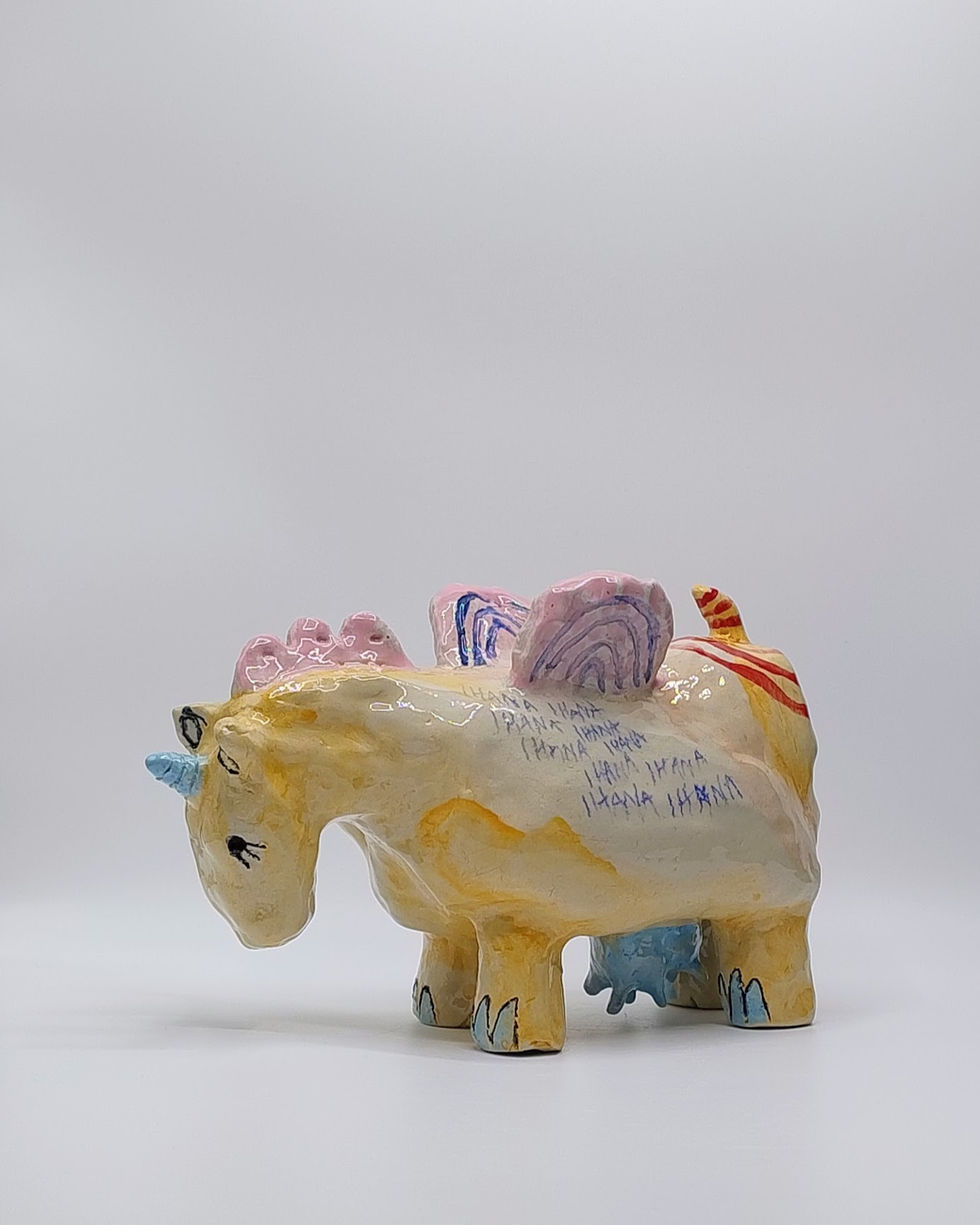 Hand-built and painted sculpture featuring the artist’s playful style and vivid colors.
