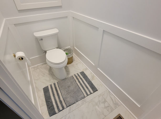 powder-room-large-format-marble-tile-custom-wainscoting evans ga