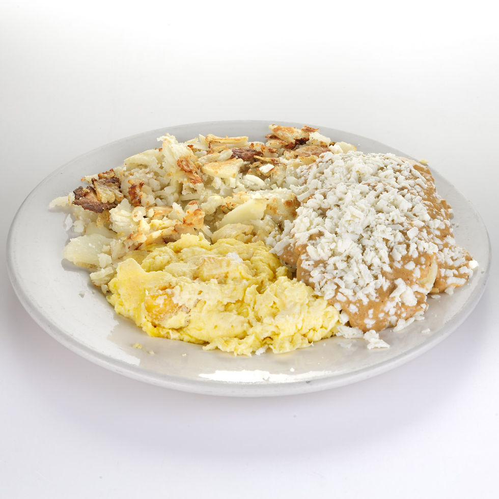 Griddled biscuits with eggs covered with house-made chorizo sausage gravy and queso fresco