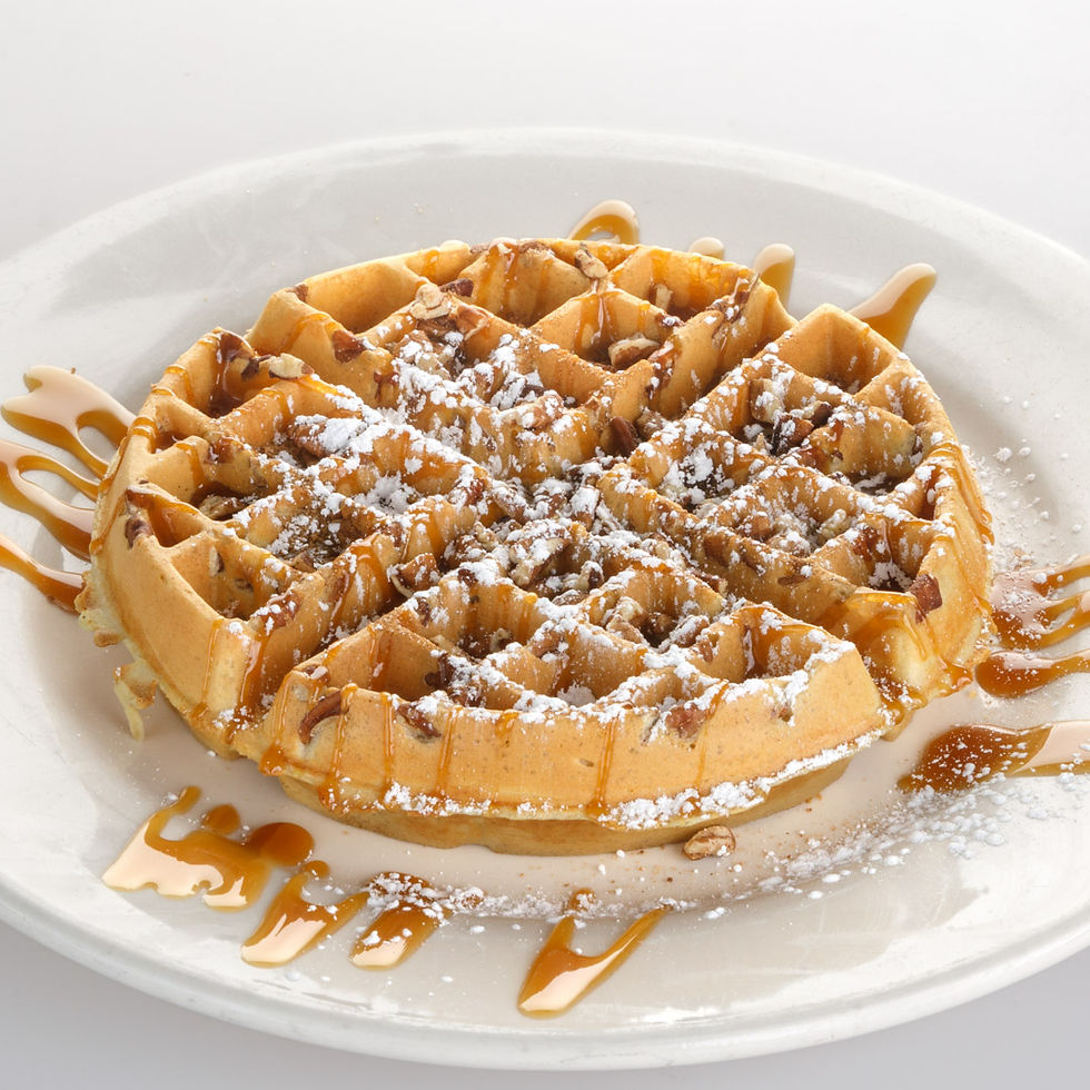 A crisp waffle topped with cinnamon sugar and a churro-style finish.