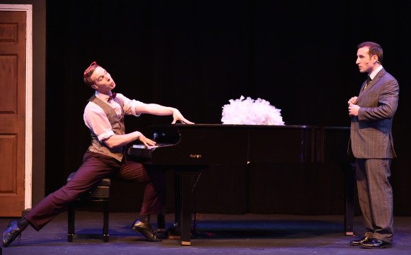 Two performers on stage at a dueling piano show with a ProKey