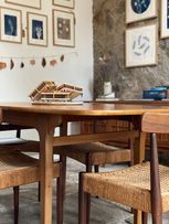 Mid century furniture in a rustic farm building. The art studio of Lisa Howard.