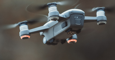 Drone inspecting pipeline or facility infrastructure to identify hazards and maintenance needs.