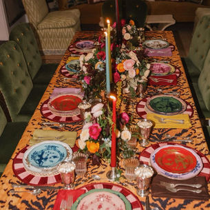 A table set with mismatched ornamental items