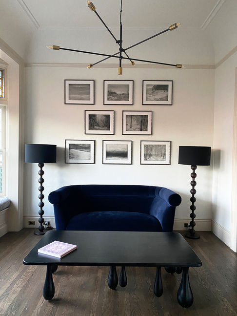 Arrangement of framed etchings in a formal sitting room