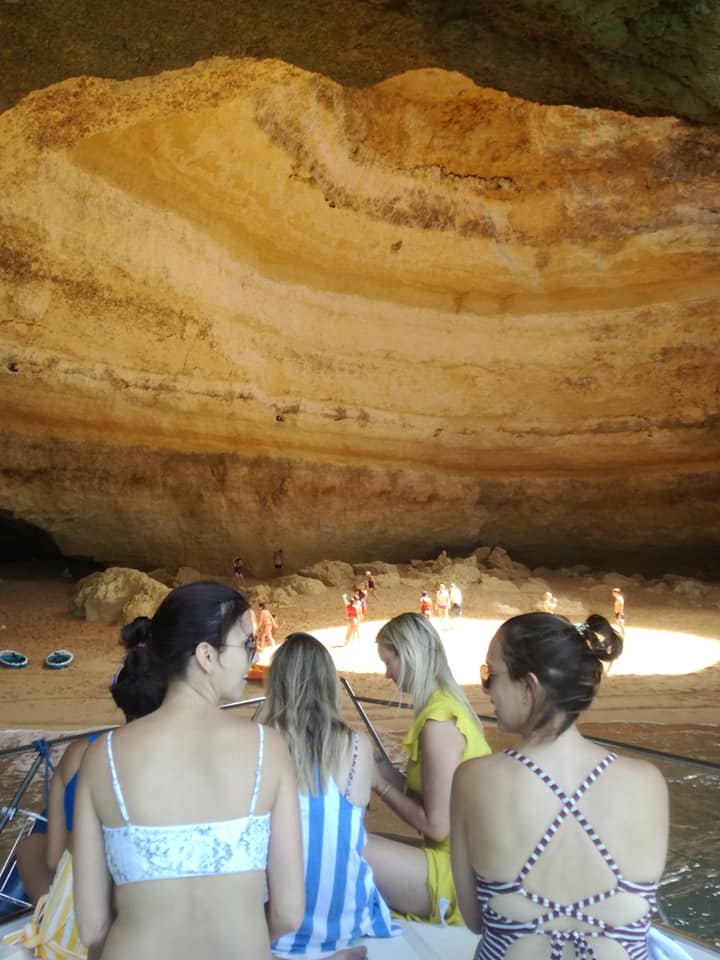 Girls on Nauti Girl inside Benagil cave.