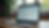 Eye-level view of a laptop screen showing an email inbox with promotional messages