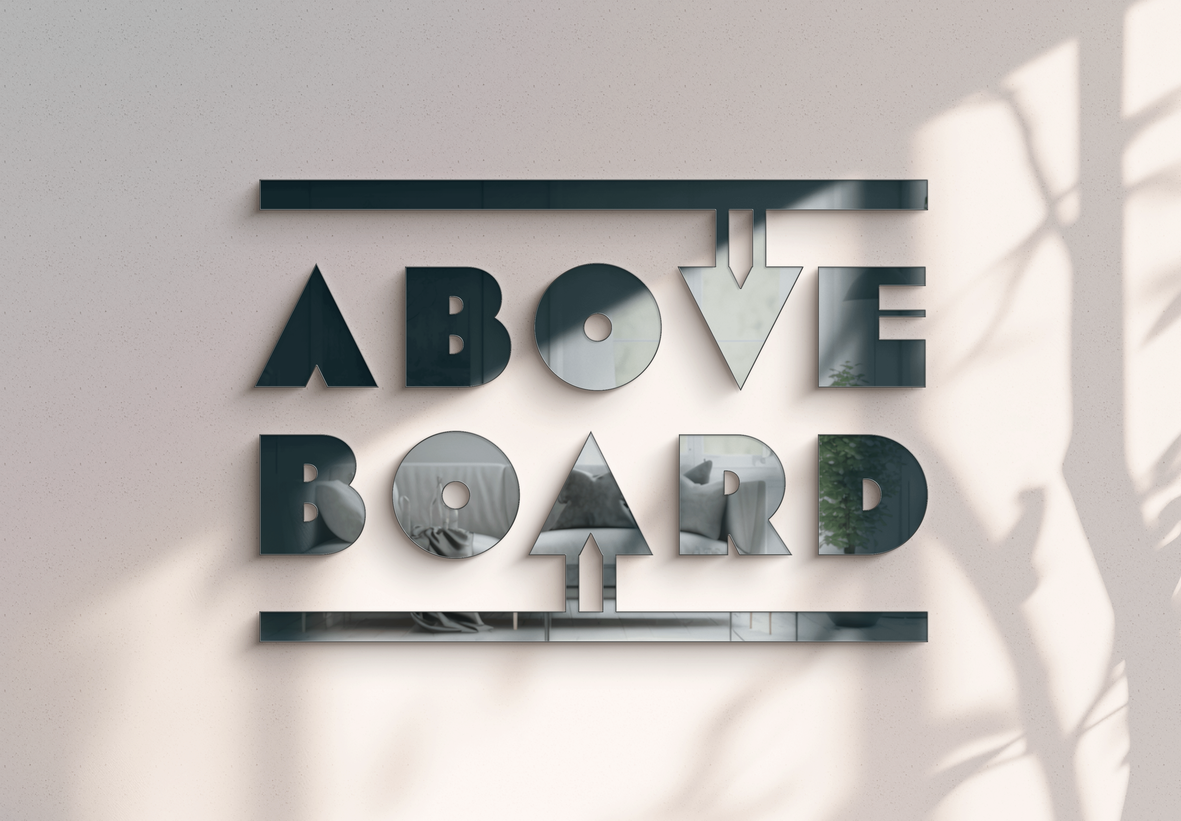 Dimensional signage and logo design featuring custom lettering mounted on a modern architectural wal