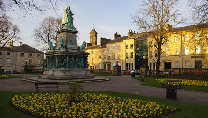 Although linguistics is a relatively young discipline, which emerged in its mature form only between the first and the second half of the 19th century, human language has been the object of philosophical and scientific inquiry for a long time in human history. In Western tradition, one of the most respected and influential contributions to this inquiry was given by the work of Aristotle. Besides being a philosopher and not a linguist, he was one of the first thinkers to recognise some distinctive properties of language.Because his work was logically oriented, he investigated how statements are expressed in terms of their truth values. According to Aristotle, the most interesting fact about statements expressed in natural languages is that they may be judged as expressing either a true or false state of facts. Quite sensibly, he did not assume that any statement is of this sort. Some linguistic statements, in fact, do not express any truth value: these expressions include exclamations, prayers, insults, and so forth. Nevertheless, Aristotle decided to focus not on the latter but on the former: those which can be judged as true or false. Almost 2500 years later, the study of these “non-constative” statements was reconsidered by one of the most influential philosophers of the 20th century, John L. Austin (Hacker, 2004). John Austin: His Life and Works             John Langshaw Austin was born in Lancaster (Figure 1) in 1911. He initially focused on classical studies at Oxford, paying attention to both the linguistic and the philosophical side. His specialty in the area of Classics led to an interest in Greek philosophy, with particular interest in Aristotle. After exploring ancient philosophy, he expanded his initial classical background into a wider work on debates in modern philosophy. Serving in the intelligence corps between 1941 and 1945, after the War, he pursued a career in professorship, teaching at Christ Church College from 1952 until his  untimely death in 1960. In this period, he became widely known in the philosophical and linguistic community, coming in contact with major intellectuals of this time, among whom Grice and Chomsky.             During his lifetime, Austin only published articles. The philosophical contributions of Austin lie in three areas: perception, action, and the theory of speech acts. For the purposes of this article, the focus will be on the last area, which is the topic mainly issued in his collected lectures How to Do Things with Words  (1962), containing the lessons he held at Harvard University in 1955.  Other works from the author include Philosophical Papers  (1961) [include 'and'] Sense and Sensibilia (1962) (Hacker, 2004). Cambridge and Oxford Schools             The period in which Austin lived and worked was characterized by an outstanding development of the philosophy of language in Europe, and in the United States too. In England, it developed especially at Cambridge and Oxford University. In Cambridge, Ludwig Wittgenstein (1889-1951), who had previously worked on the logical aspects of language, i.e., turned to a completely different vision of language itself, focusing more on the way it is used in ordinary contexts. In this new approach, Wittgenstein does not think that language denotes objects in the world, but rather that it is mainly dependent on the social context and therefore is somewhat comparable to a game, whose player must know a set of rules to participate in. Although Wittgenstein never refers to this new fashion of studying language as ["]pragmatics,["] he is one of the first thinkers to adopt a pragmatic vision of language. This attention to the practical aspects of language use started to spread in other places, Oxford included. Here Austin, without referring explicitly to Wittgenstein, showed the very same attention to the pragmatic aspect of language (Graffi 2019).             This approach to language was totally different from that of other philosophers like Gottlob Frege (1848-1925) and Bertrand Russell (1872-1970, Figure 2), who regarded natural languages as imperfect artifacts that ['that' not 'who' as artifact is an object] needed to be analyzed in their internal, logical, aspects, leaving aside all those ambiguities who characterize its communicative aspect in everyday life. According to them, language is mainly a way to refer to reality and its object, rather than to communicate something. Under this vision, there is a strong relationship between language and reality. Indeed, this theory is often referred to as the referential theory of meaning. The new conception developed by Wittgenstein, instead, negated this relationship between language and reality, stating that the way language refers to reality is highly dependent on external factors, namely cultural and social ones. All these factors are expressed in the only empirically evident way to humans, namely context of use: the particular social conditions in which a word is used transmits its meaning. (Ježek, 2016) Constative vs. Performative: Austin’s Insight 	As mentioned earlier, Aristotle had acknowledged [Acknowledged? Demonstrated? It's not enough that he understood it]] the existence of the kinds of expressions which do not state something is true or false about the world. But it was Austin who thought such expressions could be the object of a specific philosophical and linguistic inquiry. He thus adopted the adjective constative  to refer to statements analyzable in terms of truth values, as intended by Aristotle, and performative  to refer to statements that do not predicate something about reality but rather serve to perform actions. To make clear this distinction, consider the following examples. A sentence like'it is raining' is constative since it may be true or false depending on the meteorological conditions when such a statement is expressed. On the contrary, a sentence like 'I pronounce you man and wife', which people hear at weddings do not respond to truth conditions (this statement is neither true or false per se ), but it is the expression of an act: in this case, the formalization of an agreement binding two individuals. Such statements are not judged according to truth values, but rather according to the effect they have in the considered social context. Thus, they respond to ‘felicity conditions’: a speech act is felicitous (successful) if it performs the action it is supposed to, and infelicitous otherwise. In this case, the expression if felicitous if it is pronounced by an individual who is able to marry people according to the law (e.g., a Justice of the Peace)             Austin realized that such a distinction is not exhaustive, since constative and performative acts may overlap, i.e., felicity conditions may affect constatives and truth conditions may affect performatives. Austin mentions the case of a verdict in which an individual is judged guilty. It surely responds to felicity conditions, but it also responds to truthconditions depending on the fact whether that individual has, or has not, committed the crime he has been condemned for. As an example, in which truth and falseness affect a performative act is given by the following statement: all of John’s children are tall, but John does not have children . In this case, the performative nature of the first half of the statement is a so-called presupposition (‘John has children’), which is then negated in the second half, making the statement infelicitous, other than contradictory (John’s children cannot be tall if John does not have any of them) (Austin, 1962).             The fact that performative and constative acts are not always clearly distinguishable led Austin to a new classification of speech acts. He thus divides three types of speech acts: locutory, illocutory, and perlocutory. Locutory acts are those which consist of a phonetic substance and carry a meaning ( The door is open ); illocutory acts are those which perform an action, like prayers, requests, orders, insults (a sentence like close that door  is performing a request, other than informing the door is currently open); perlocutory acts are those which are performed as an effect of a pronounced statement (the door being closed after the relevant request has been performed). In Austin’s conception, thus, the opposition true vs. false and felicitous vs. infelicitous affects all kinds of speech acts, both constative and performative. This is a clear change of the Aristotelian paradigm (Figure 3), which distinguished assertive statements from all the others for they could be judged upon truth conditions (Graffi, 2019) Conclusion 	Austin is rightly considered one of the most important philosophers of language of the 20th century. His work, taking Aristotle's reflections as basis, had crucial outcomes. Together with Wittgenstein, he is considered one of the major influences in the new field of pragmatic linguistics or pragmatics. The most crucial innovation of Austin has been to isolate the performative and constative aspects of speech acts. After realizing that certain statements serve to perform actions rather than talk about something, he then makes clear that any kind of speech act has a constative and performative layer, and each of them is analyzableon its own. This new interest towards the practical side of language use differentiate him from other philosophers of the period who, focusing more on logic and inspired by Frege and Russell, wanted to develop formal systems able to describe natural languages with no regard to social context. Despite his early death, his contribution to the philosophy of language is one of the most original and influential of the past century and it's still central to inquiries in philosophy and linguistics. References Austin, J. L. (1962). How to Do Things with Words: The William James Lectures delivered at Harvard University in 1955 . Oxford: Clarendon Press. Graffi, G. (2019). Breve storia della linguistica . Carocci editore. Hacker, P. (2004). 'Austin, John Langshaw (1911–1960)', in Oxford Dictionary of National Biography. Oxford University Press. Ježek, E. (2016). The Lexicon. An Introduction . Oxford University Press. Visual Sources Figure 1. Dalton Square, Lancaster by Ian Taylor, CC BY-SA 2.0 <https://creativecommons.org/licenses/by-sa/2.0>, via Wikimedia Commons. Figure 2. Anefo, CC0, via Wikimedia Commons. Figure 3. Arman Kashef, CC BY-SA 4.0 <https://creativecommons.org/licenses/by-sa/4.0>, via Wikimedia Commons.