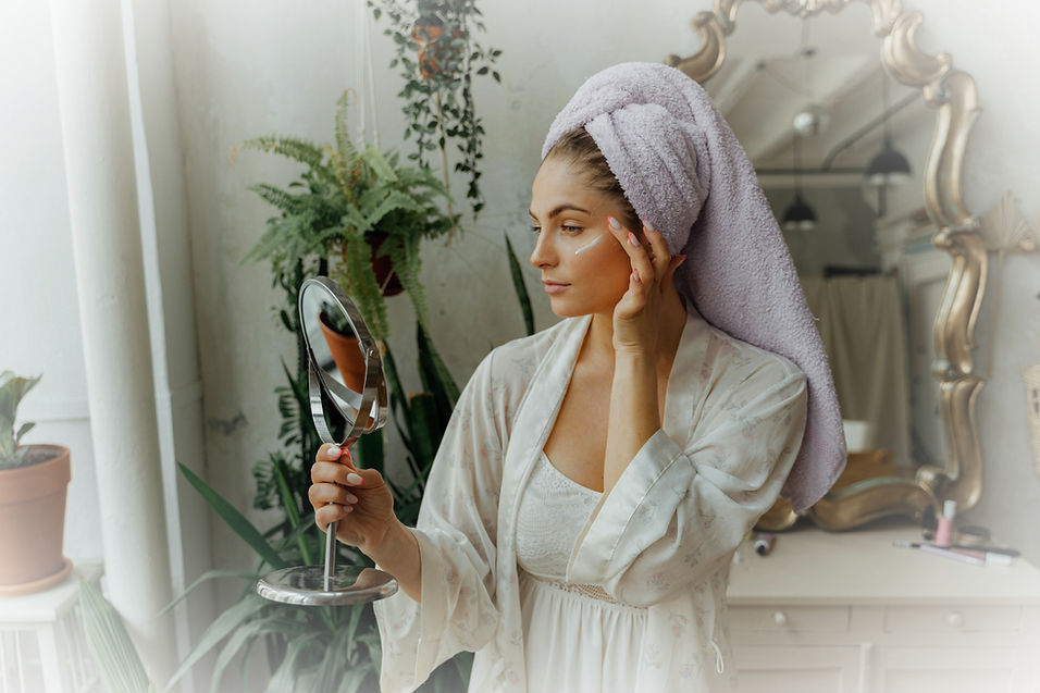 A woman looking at herself in the mirror