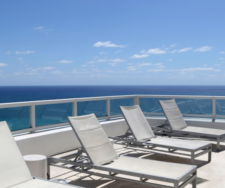 a row of lounge chairs on deck of ship