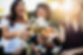 three women making a toast with their wine glasses