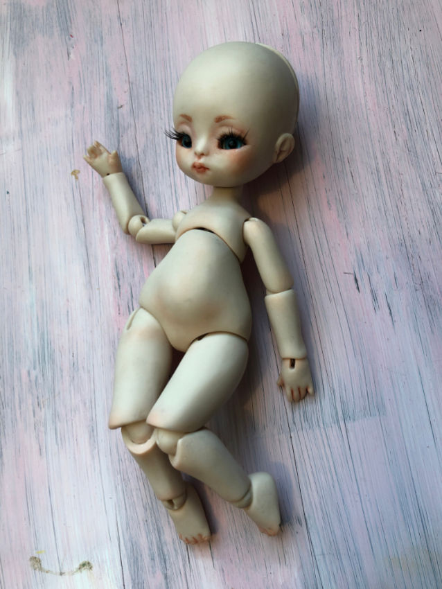 Thumbnail: www.elenaorigianls.com -  Face-up: The painting and customization of the doll's face, including eyes, eyebrows, and lips.