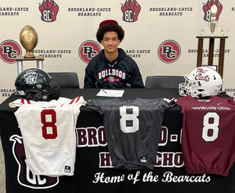 BROOKLAND-CAYCE HIGH SCHOOL FOOTBALL PLAYER PARTICIPATES IN SIGNING DAY CEREMONY