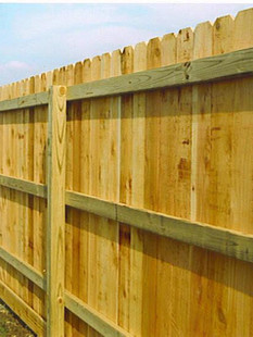 A wooden privacy fence. Click to visit apluscontractors.us/fencing-services