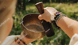stock-photo-close-up-of-female-hands-holding-sound-healing-instruments-tools-for-therapy-i