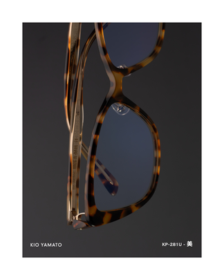 Side view of KP-281U eyeglasses, showing the full frame profile with translucent tortoiseshell acetate and balanced proportions.