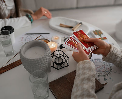 high-angle-woman-reading-tarot-home.jpg