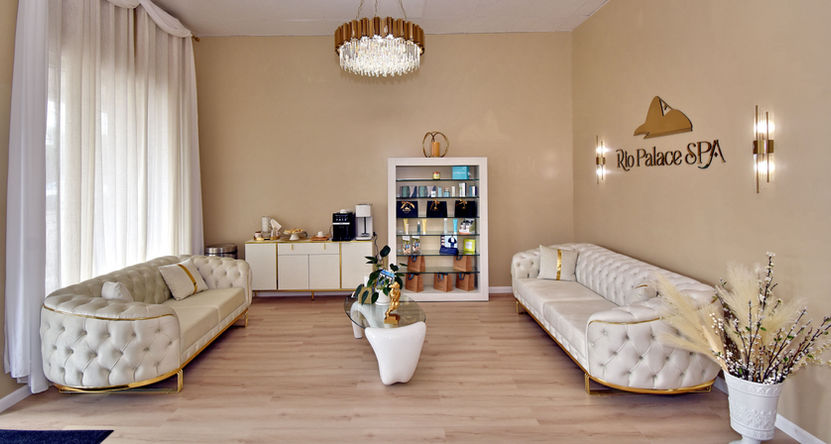 Elegant waiting area with two white sofas and