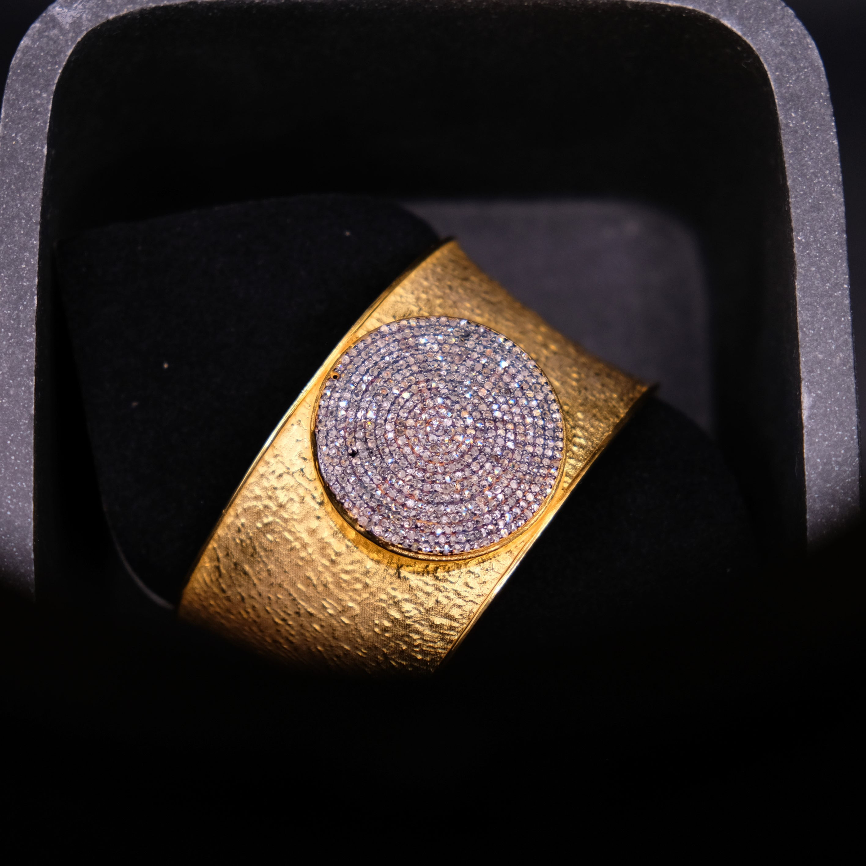 An extraordinary sterling silver, gold and diamond bangle