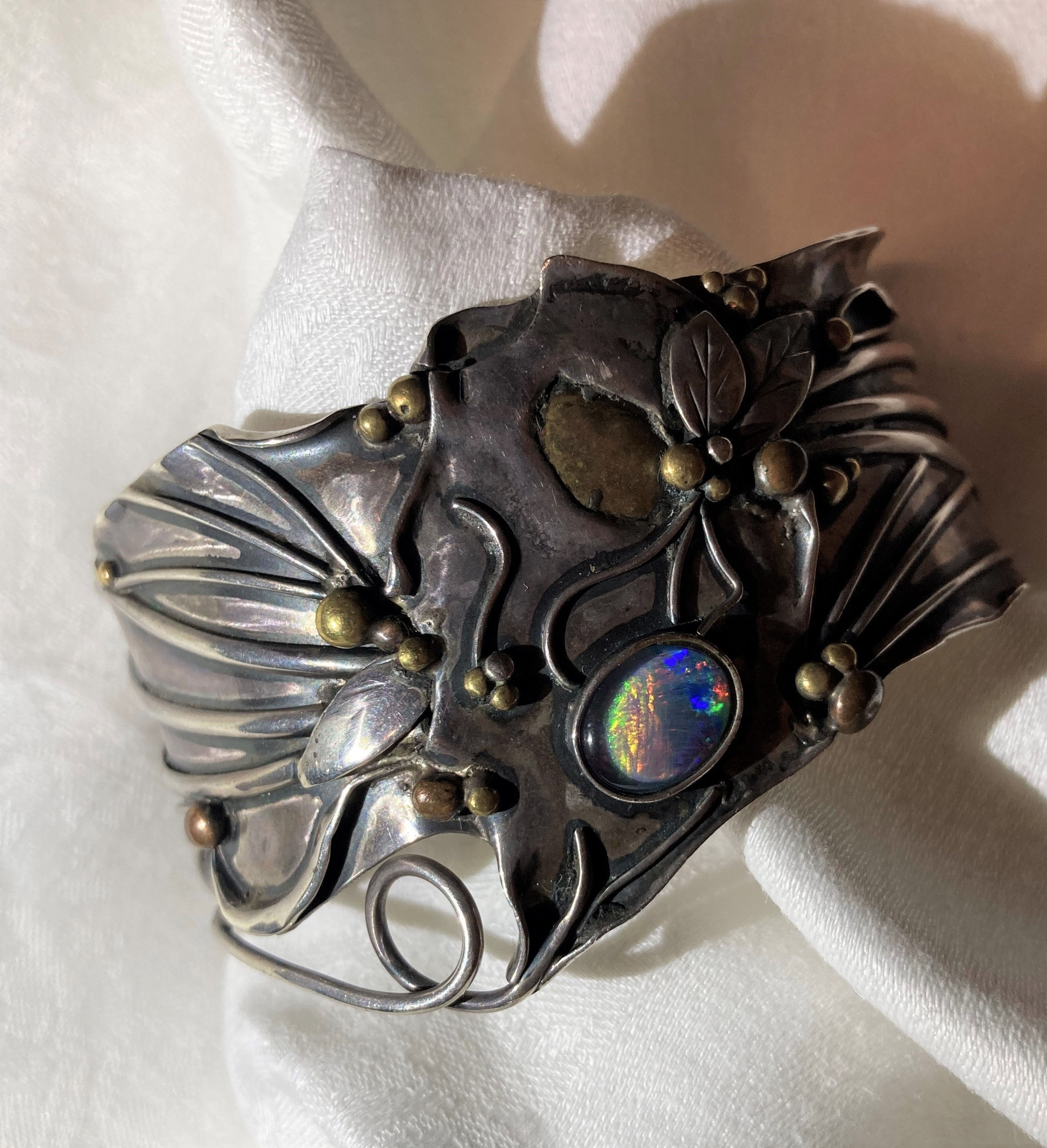 An Art Nouveau style silver bangle