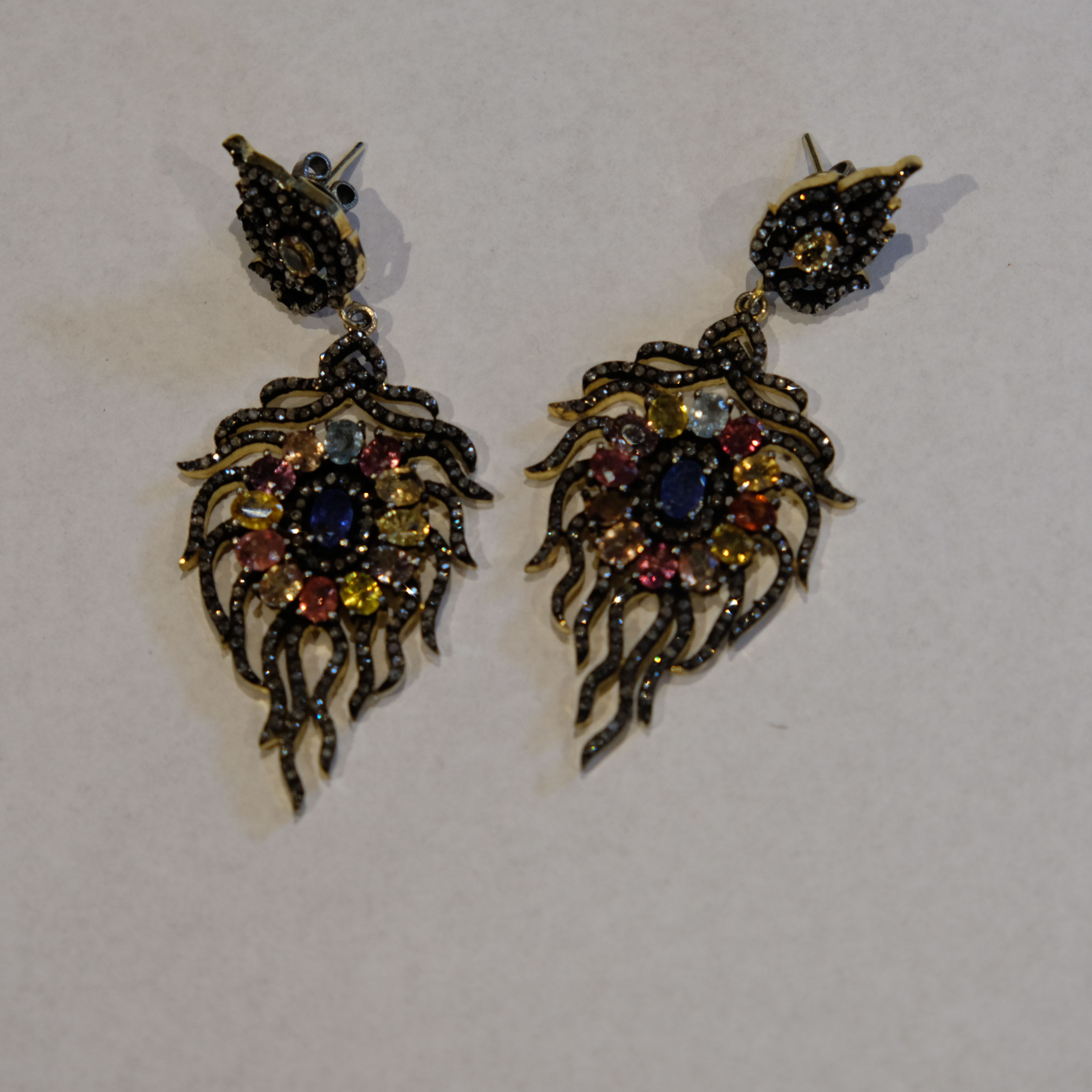 A pair of gem set and diamond drop earrings
