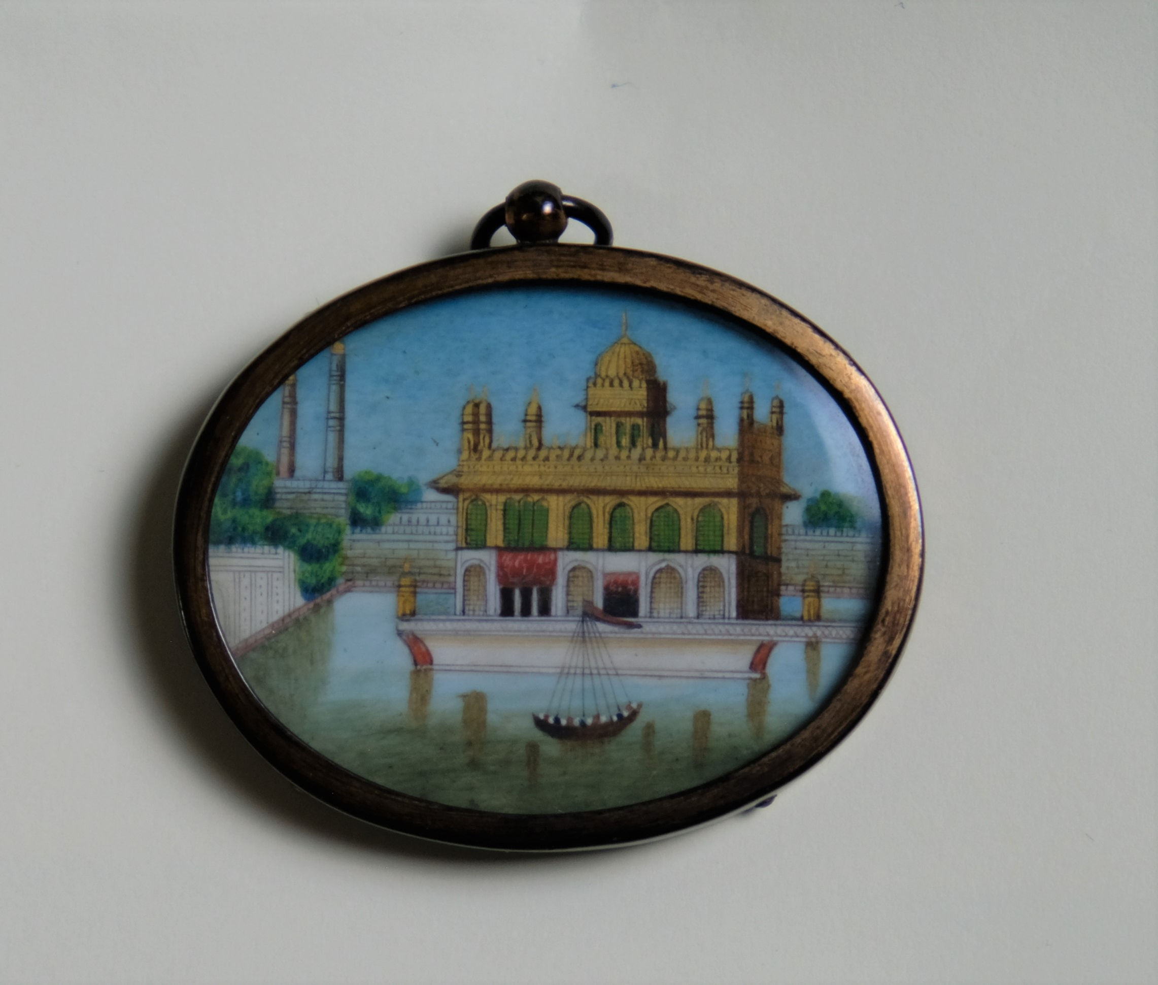 An Indian copper framed gilded miniature on ivory of the Golden Temple