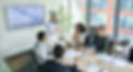 Senior female ceo and multicultural business people discussing company presentation at boa