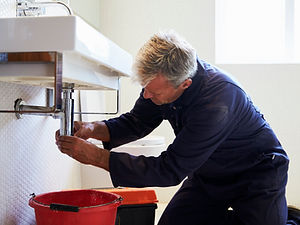 plumber-working-on-sink-in-bathroom-2021-08-26-16-13-07-utc (1).jpg
