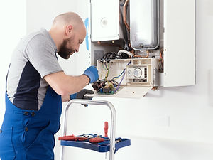 qualified-engineer-servicing-a-boiler-2022-12-14-03-51-13-utc.jpg