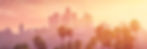 Los Angeles skyline at sunset with palm trees
