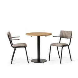 Round oak table with two gray upholstered armchairs