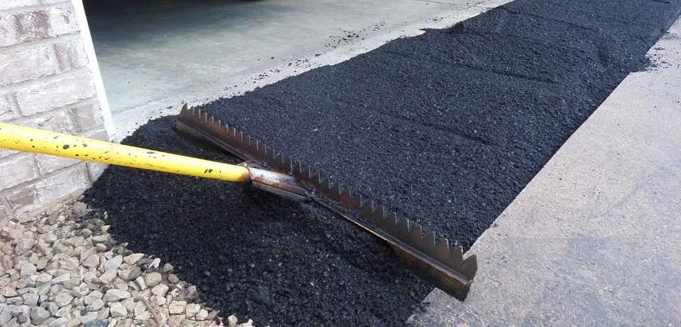 Asphalt patching on a garage ramp by discount potholes and sealings in Richmond Hill
