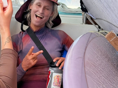 Kassia Meador enjoying the boat to the surfbreak