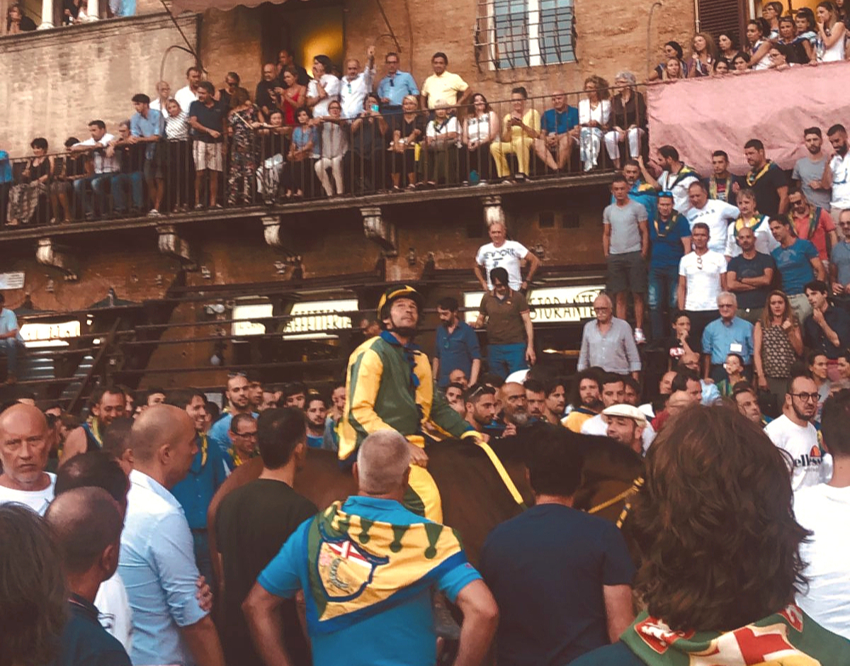 A Palio jockey lifts his gaze to the heavens.