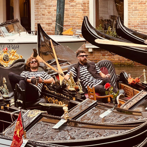 Gondoliers relaxing in Venice