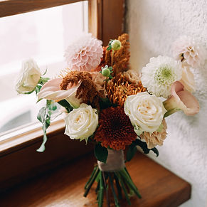 Bride bouquet stands on the windowsill i