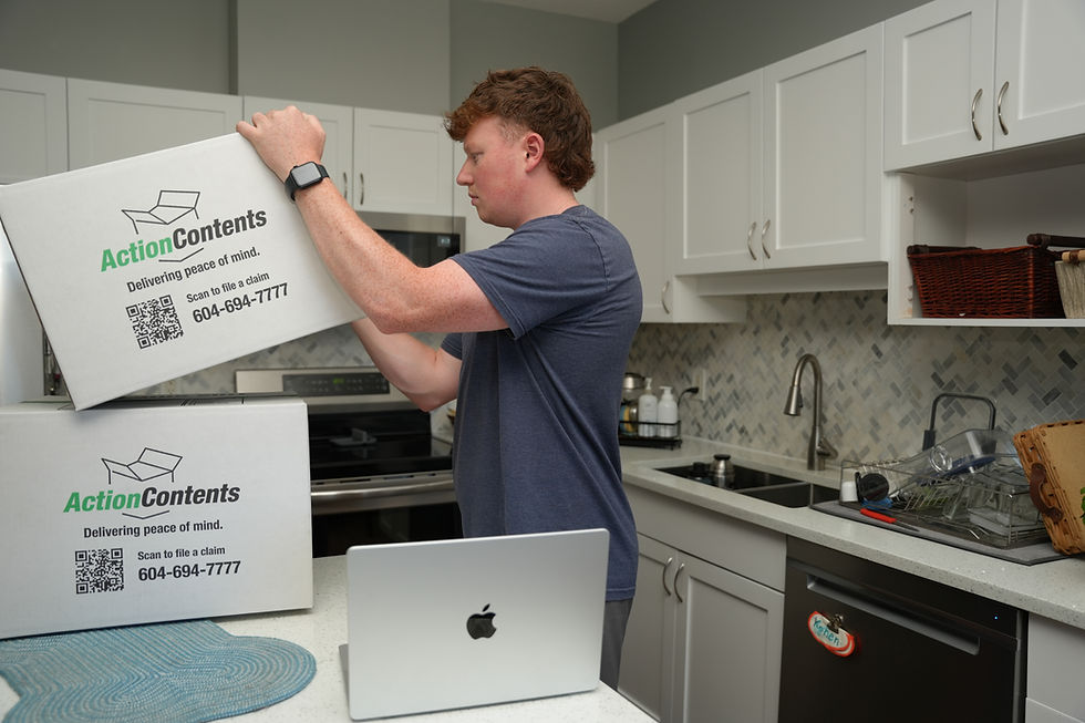 Action Contents team member sealing a branded contents box during a pack-out in a client's kitchen
