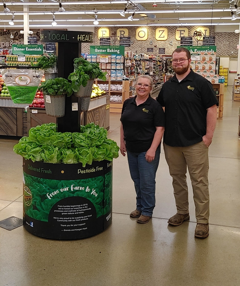 Brenda and Keegan at a MHP retail display