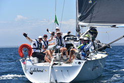 Marion McRae sailing with her team.png