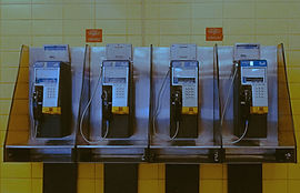 payphones against yellow tile wall in underground subway station_edited.jpg