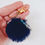 Thumbnail: Blue Silver Glitter Resin Moon Star on Midnight Blue Pom Pom Keychain