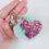 Thumbnail: Purple Ink Resin Heart on Pale Green Blue Pom Pom Keychain