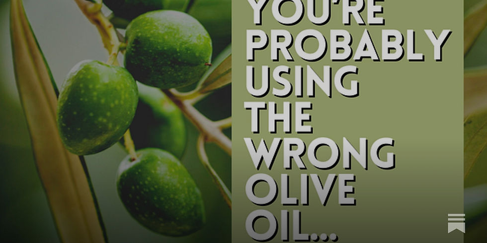 Close-up view of a bottle of pure olive oil on a wooden table